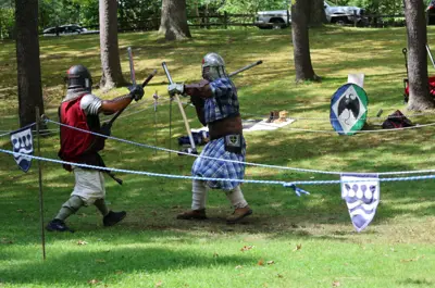 people fighting while dressed in medieval clothing